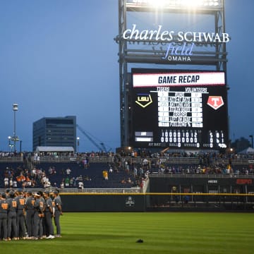 Tennessee huddles in the outfield after the NCAA College World Series game between Tennessee and LSU held at Charles Schwab Field in Omaha, Nebraska, Tuesday, June 20, 2023. LSU defeated Tennessee.
