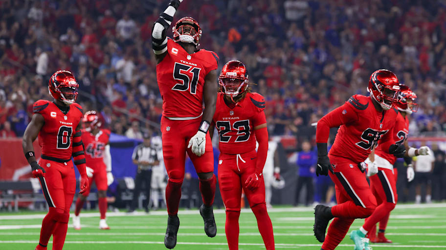 Texans defenders celebrate after a big play.