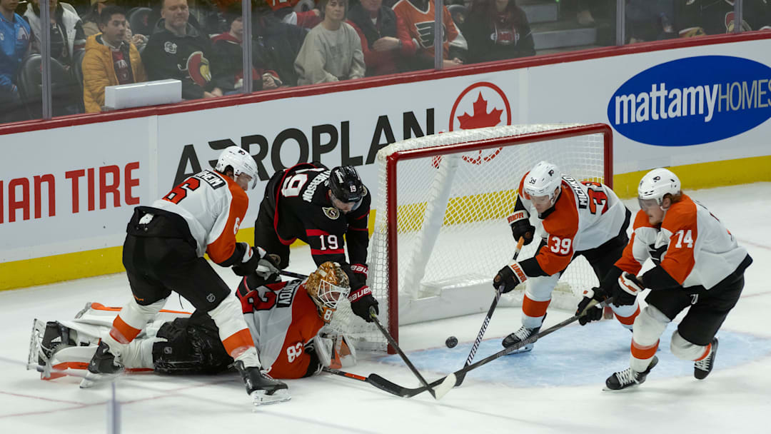Nov 14, 2024; Ottawa, Ontario, CAN; Ottawa Senators right wing Drake Batherson (19) is unable to capitalize on a loose puck in front of the Philadelphia Flyers net before right wing Matvei Michkov (39) and right wing Owen Tippett (74) clear the puck in the third period at the Canadian Tire Centre.