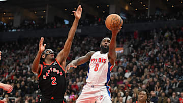 Apr 4, 2025; Toronto, Ontario, CAN;  Detroit Pistons guard Tim Hardaway Jr. (8) shoots the ball against Toronto Raptors forward Jonathan Mogbo (2) in the first half at Scotiabank Arena. Mandatory Credit: Dan Hamilton-Imagn Images