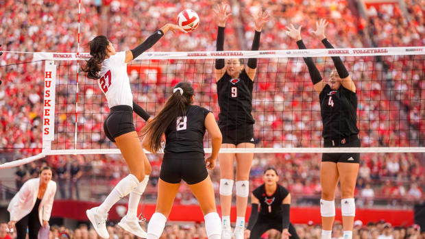 Nebraska Cornhuskers outside hitter Harper Murray (27) attacks the ball against the Omaha Mavericks during the first set at M