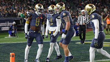 Nov 23, 2024; New York, New York, USA; Notre Dame Fighting Irish safety Adon Shuler (8) and Notre Dame Fighting Irish linebacker Jaylen Sneed (3) celebrate a defense stop during the first half against the Army Black Knights at Yankee Stadium. 