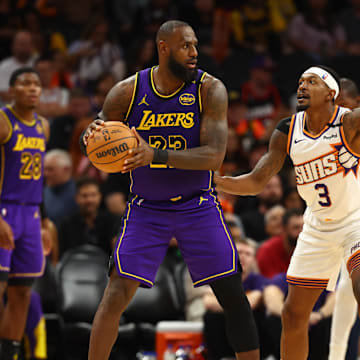 Oct 28, 2024; Phoenix, Arizona, USA; Los Angeles Lakers forward LeBron James (23) against Phoenix Suns guard Bradley Beal (3) at Footprint Center. Mandatory Credit: Mark J. Rebilas-Imagn Images