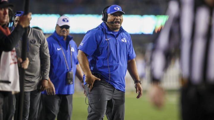 Nov 4, 2023; Morgantown, West Virginia, USA; Brigham Young Cougars head coach Kalani Sitake reacts to a penalty during the first quarter against the West Virginia Mountaineers at Mountaineer Field at Milan Puskar Stadium. Mandatory Credit: Ben Queen-USA TODAY Sports