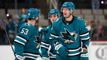 Sep 21, 2025; San Jose, California, USA; San Jose Sharks defenseman John Klingberg (3) celebrates with left wing Jeff Skinner (53) and forward Michael Misa (77) after scoring a power play goal against the Vegas Golden Knights during the second period at SAP Center at San Jose. Mandatory Credit: Robert Edwards-Imagn Images