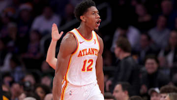 Dec 11, 2024; New York, New York, USA; Atlanta Hawks forward De'Andre Hunter (12) celebrates his three point shot against the New York Knicks during the third quarter at Madison Square Garden. Mandatory Credit: Brad Penner-Imagn Images