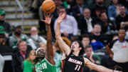 Apr 24, 2024; Boston, Massachusetts, USA; Jump ball against Boston Celtics guard Jrue Holiday (4) and Miami Heat guard Jaime Jaquez Jr. (11) in the second half during game two of the first round for the 2024 NBA playoffs at TD Garden. Mandatory Credit: David Butler II-USA TODAY Sports