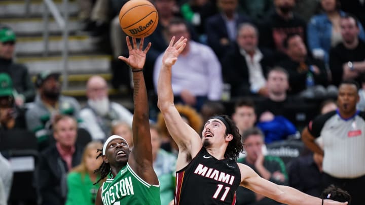 Apr 24, 2024; Boston, Massachusetts, USA; Jump ball against Boston Celtics guard Jrue Holiday (4) and Miami Heat guard Jaime Jaquez Jr. (11) in the second half during game two of the first round for the 2024 NBA playoffs at TD Garden. Mandatory Credit: David Butler II-USA TODAY Sports