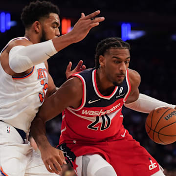 Nov 3, 2025; New York, New York, USA; New York Knicks center Karl-Anthony Towns (32) defends Washington center Alex Sarr (20) during the second half at Madison Square Garden. Mandatory Credit: Lucas Boland-Imagn Images