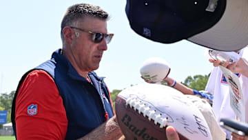 Jul 28, 2025; Foxborough, MA, USA; New England Patriots head coach Mike Vrabel signs an autograph after training camp at Gillette Stadium. Mandatory Credit: Eric Canha-Imagn Images