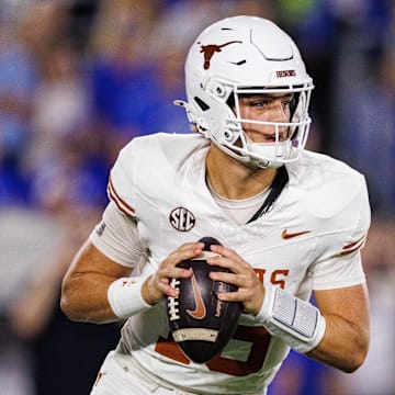 Texas Longhorns quarterback Arch Manning looks for an open receiver during the first quarter against the Kentucky Wildcats at Kroger Field.