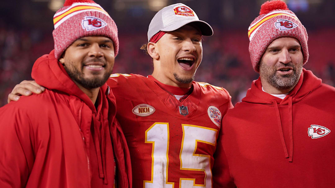 Dec 31, 2023; Kansas City, Missouri, USA; Kansas City Chiefs quarterback Chris Oladokun (13), quarterback Patrick Mahomes (15), and quarterbacks coach David Girardi (left to right) pose for a photo after the game against the Cincinnati Bengals at GEHA Field at Arrowhead Stadium. Dec 31, 2023; Kansas City, Missouri, USA; Kansas City Chiefs quarterback Chris Oladokun (13), quarterback Patrick Mahomes (15), and quarterbacks coach David Girardi (left to right) pose for a photo after the game against the Cincinnati Bengals at GEHA Field at Arrowhead Stadium.