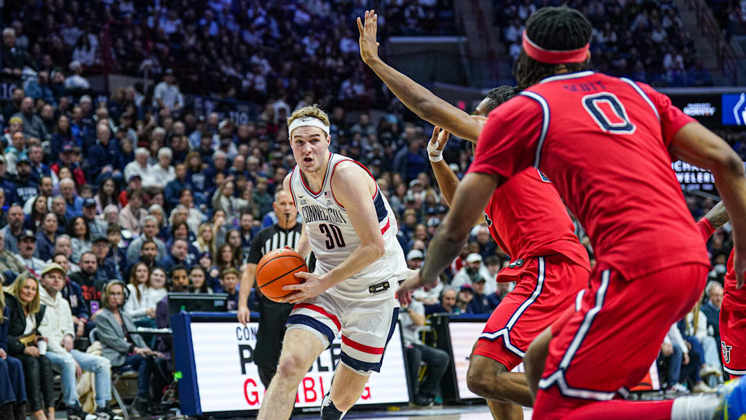 Feb 7, 2025; Storrs, Connecticut, USA; UConn Huskies forward Liam McNeeley (30) drivers the ball against the St. John's Red Storm in the first half at Harry A. Gampel Pavilion. Mandatory Credit: David Butler II-Imagn Images