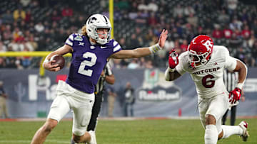 Kansas State quarterback Avery Johnson (2) scrambles against Rutgers during second half of the Rate Bowl at Chase Field on Dec. 26, 2024, in Phoenix.