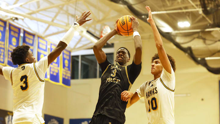 AJ Dybantsa drives against Nate Ament (10) during a game at Emmanuel College in Boston on Tuesday, Nov. 5, 2024.