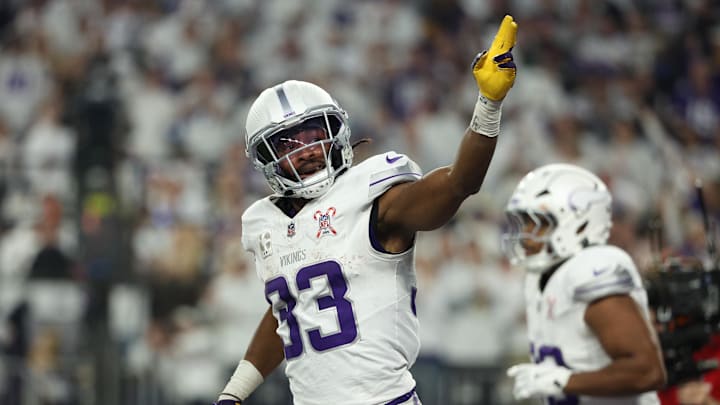 Dec 25, 2025; Minneapolis, Minnesota, USA; Minnesota Vikings running back Aaron Jones Sr. (33) celebrates after scoring a touchdown against the Detroit Lions in the first quarter at U.S. Bank Stadium. Mandatory Credit: Matt Krohn-Imagn Images