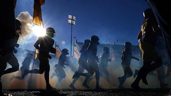 The West Virginia Mountaineers takes the field prior to an NCAA college football game against the Cincinnati Bearcats, Saturday, Nov. 18, 2023, at Milan Puskar Stadium in Morgantown, W. Va.