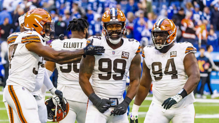 Oct 22, 2023; Indianapolis, Indiana, USA; Cleveland Browns defensive end Za'Darius Smith (99) celebrates his strip sack of the ball with teammates  in the second half against the Indianapolis Colts at Lucas Oil Stadium. Mandatory Credit: Trevor Ruszkowski-USA TODAY Sports