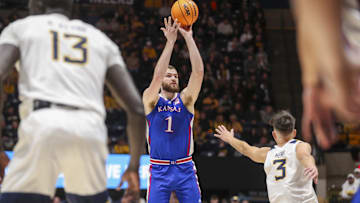 Jan 20, 2024; Morgantown, West Virginia, USA; Kansas Jayhawks center Hunter Dickinson (1) shoots a three-point shot during the first half against the West Virginia Mountaineers at WVU Coliseum. Mandatory Credit: Ben Queen-Imagn Images
