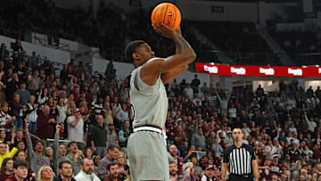 Feb 18, 2025; Starkville, Mississippi, USA; Mississippi State Bulldogs guard Shawn Jones Jr. (5) shoots during the second half against the Texas A&M Aggies at Humphrey Coliseum. Mandatory Credit: Petre Thomas-Imagn Images