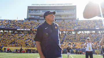 Aug 30, 2025; Morgantown, West Virginia, USA; West Virginia Mountaineers head coach Rich Rodriguez sings “Country Roads” after defeating the Robert Morris Colonials at Milan Puskar Stadium. Mandatory Credit: Ben Queen-Imagn Images