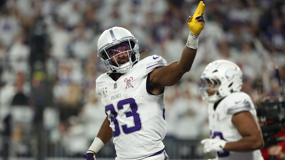 Dec 25, 2025; Minneapolis, Minnesota, USA; Minnesota Vikings running back Aaron Jones Sr. (33) celebrates after scoring a touchdown against the Detroit Lions in the first quarter at U.S. Bank Stadium. 