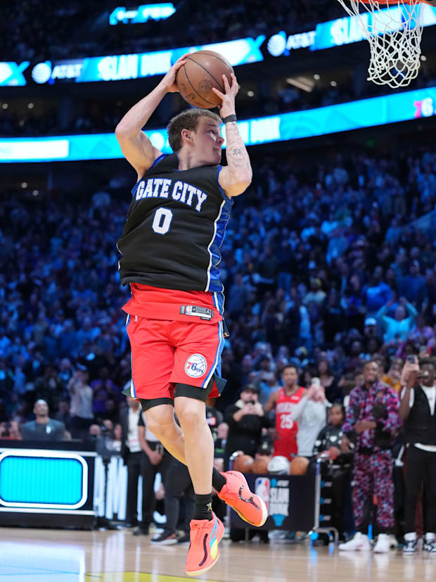 Mac McClung participating in the 2023 NBA Dunk Contest with his high school jersey on.