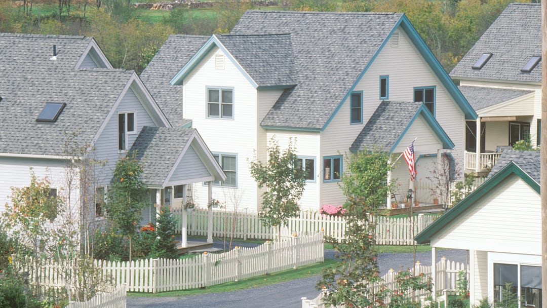 New England neighborhood with white picket fences