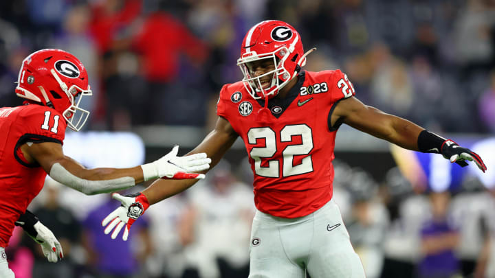 Jan 9, 2023; Inglewood, CA, USA; Georgia Bulldogs wide receiver Arian Smith (11) high fives running back Branson Robinson (22) after a touchdown against the TCU Horned Frogs during the third quarter of the CFP national championship game at SoFi Stadium. Mandatory Credit: Mark J. Rebilas-USA TODAY Sports