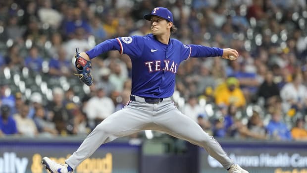 Jun 24, 2024; Milwaukee, Wisconsin, USA;  Texas Rangers pitcher Jacob Latz (67) throws a pitch during the sixth inning against the Milwaukee Brewers at American Family Field. Mandatory Credit: Jeff Hanisch-USA TODAY Sports