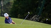 Ludvig Aberg plays from the bunker on the 18th green during the final round of the Masters Tournament.