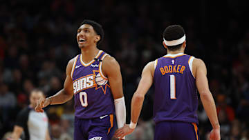 Jan 9, 2025; Phoenix, Arizona, USA; Phoenix Suns forward Ryan Dunn (0) and guard Devin Booker (1) against the Atlanta Hawks in the second half at Footprint Center. Mandatory Credit: Mark J. Rebilas-Imagn Images