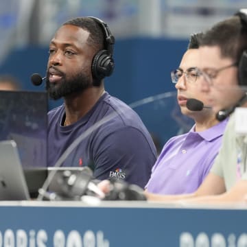 Jul 27, 2024; Villeneuve-d'Ascq, France; Dwyane Wade looks on from the media bench during the first half between Canada and Greece during the Paris 2024 Olympic Summer Games at Stade Pierre-Mauroy. Mandatory Credit: John David Mercer-USA TODAY Sports