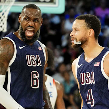 United States guard Lebron James (6) and United States shooting guard Stephen Curry (4) in the men's basketball gold medal game during the Paris 2024 Olympic Summer Games at Accor Arena. Mandatory Credit: