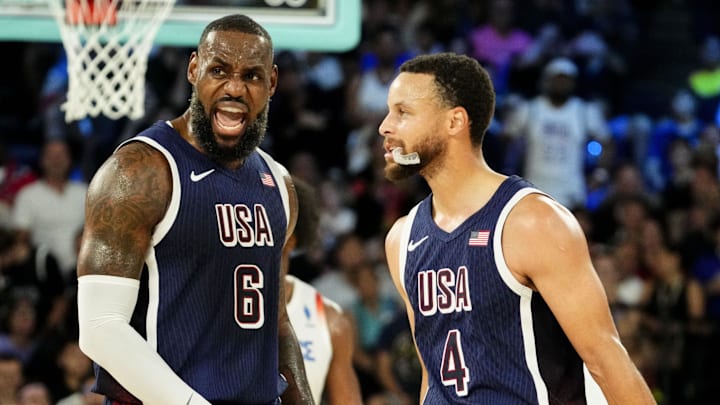 United States guard Lebron James (6) and United States shooting guard Stephen Curry (4) in the men's basketball gold medal game during the Paris 2024 Olympic Summer Games at Accor Arena. Mandatory Credit: