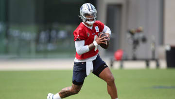 Jun 4, 2024; Frisco, TX, USA;  Dallas Cowboys quarterback Dak Prescott (4) goes through a drill during practice at the Ford Center at the Star Training Facility in Frisco, Texas. Mandatory Credit: Tim Heitman-USA TODAY Sports