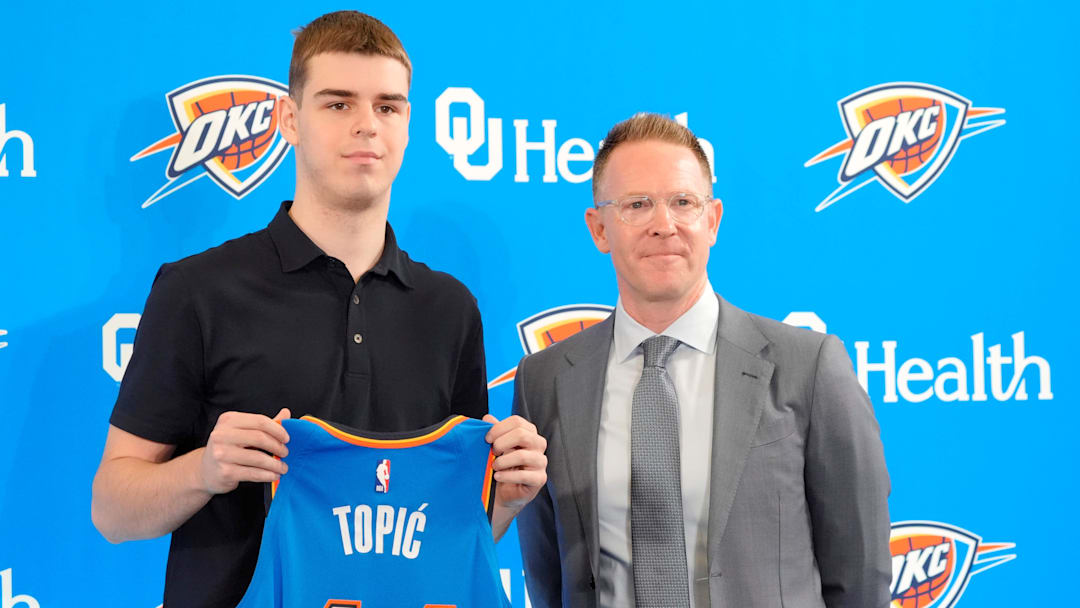 Nikola Topic stands with Thunder general manager Sam Presti during an introductory press conference for the 2024 Thunder draft picks at Oklahoma Contemporary Arts Center in Oklahoma City, Saturday, June, 29, 2024.