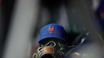Aug 8, 2024; Denver, Colorado, USA; A New York Mets hat and glove in the dugout in the second inning against the Colorado Rockies at Coors Field. Mandatory Credit: Isaiah J. Downing-Imagn Images
