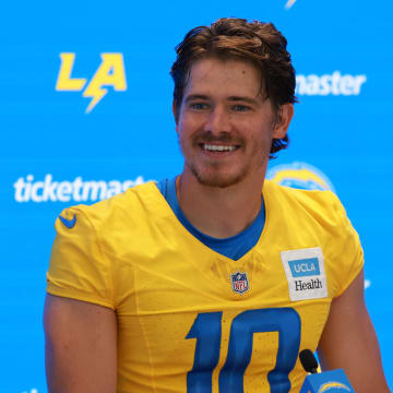 Jul 24, 2024; El Segundo, CA, USA;  Los Angeles Chargers quarterback Justin Herbert (10) speaks to the media after the first day of training camp at The Bolt. Mandatory Credit: Kiyoshi Mio-USA TODAY Sports