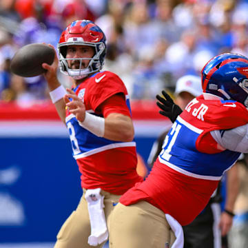 Sep 8, 2024; East Rutherford, New Jersey, USA; New York Giants quarterback Daniel Jones (8) passes the ball against the Minnesota Vikings during the second half at MetLife Stadium. Mandatory Credit: John Jones-Imagn Images