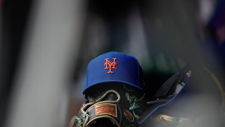Aug 8, 2024; Denver, Colorado, USA; A New York Mets hat and glove in the dugout in the second inning against the Colorado Rockies at Coors Field. Mandatory Credit: Isaiah J. Downing-Imagn Images