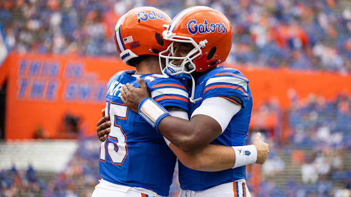 Florida Gators quarterbacks Graham Mertz (15) and DJ Lagway (2) embrace before the game against the Texas A&M Aggies