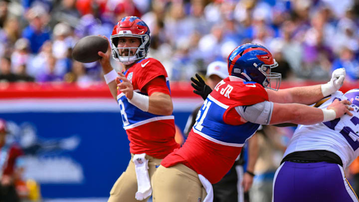 Sep 8, 2024; East Rutherford, New Jersey, USA; New York Giants quarterback Daniel Jones (8) passes the ball against the Minnesota Vikings during the second half at MetLife Stadium. Mandatory Credit: John Jones-Imagn Images