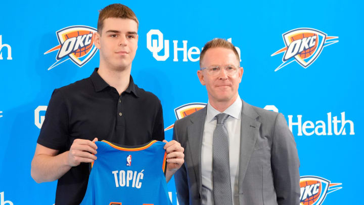 Nikola Topic stands with Thunder general manager Sam Presti during an introductory press conference for the 2024 Thunder draft picks at Oklahoma Contemporary Arts Center in Oklahoma City, Saturday, June, 29, 2024.