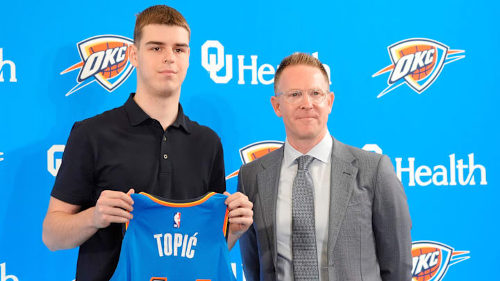 Nikola Topic stands with Thunder general manager Sam Presti during an introductory press conference for the 2024 Thunder draft picks at Oklahoma Contemporary Arts Center in Oklahoma City, Saturday, June, 29, 2024.