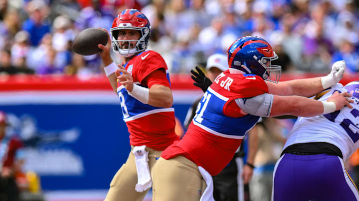 Sep 8, 2024; East Rutherford, New Jersey, USA; New York Giants quarterback Daniel Jones (8) passes the ball against the Minnesota Vikings during the second half at MetLife Stadium. Mandatory Credit: John Jones-Imagn Images