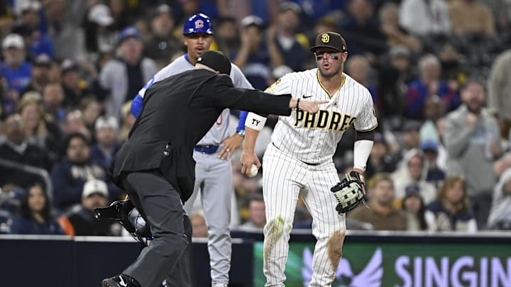 Apr 27, 2026; San Diego, California, USA; San Diego Padres third baseman Ty France (25) reacts as umpire Dan Merzel rules a single hit by Chicago Cubs third baseman Matt Shaw (6) fair during the ninth inning at Petco Park. Mandatory Credit: Denis Poroy-Imagn Images