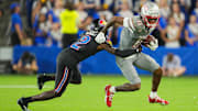 UNLV Rebels wide receiver Ricky White III (11) runs with the ball against Kansas Jayhawks cornerback Cobee Bryant (2) during the second half at Children's Mercy Park. Mandatory Credit: Jay Biggerstaff-Imagn Images