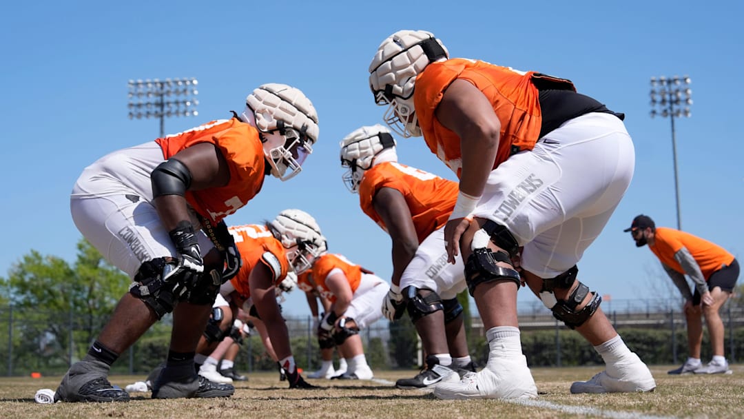 Oklahoma State offensive lineman Noah McKinney, left, and Jakobe Sanders run a drill during a Spring football practice at Oklahoma State University in Stillwater, Okla. Oklahoma State offensive lineman Noah McKinney, left, and Jakobe Sanders run a drill during a Spring football practice at Oklahoma State University in Stillwater, Okla.