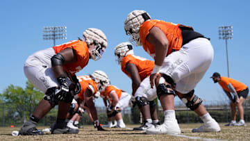 Oklahoma State offensive lineman Noah McKinney, left, and Jakobe Sanders run a drill during a Spring football practice at Oklahoma State University in Stillwater, Okla.